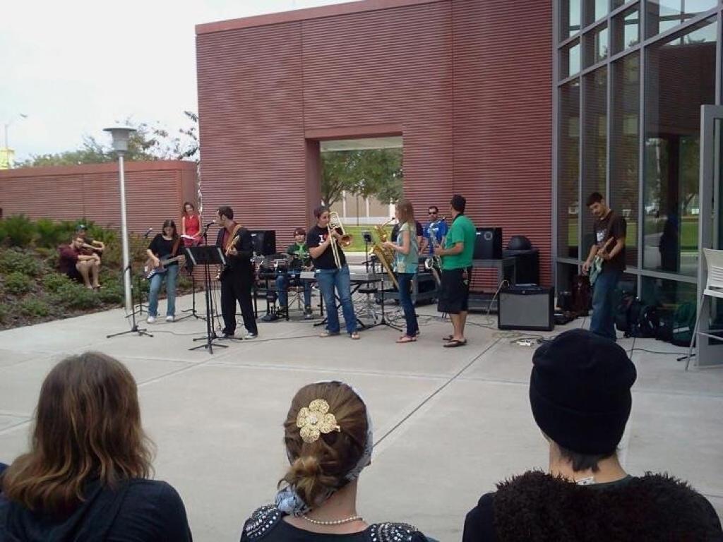 Victor in a band with his students