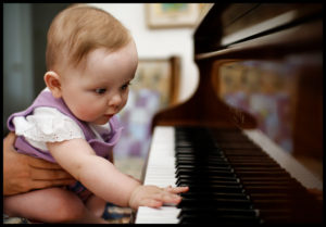 baby playing piano