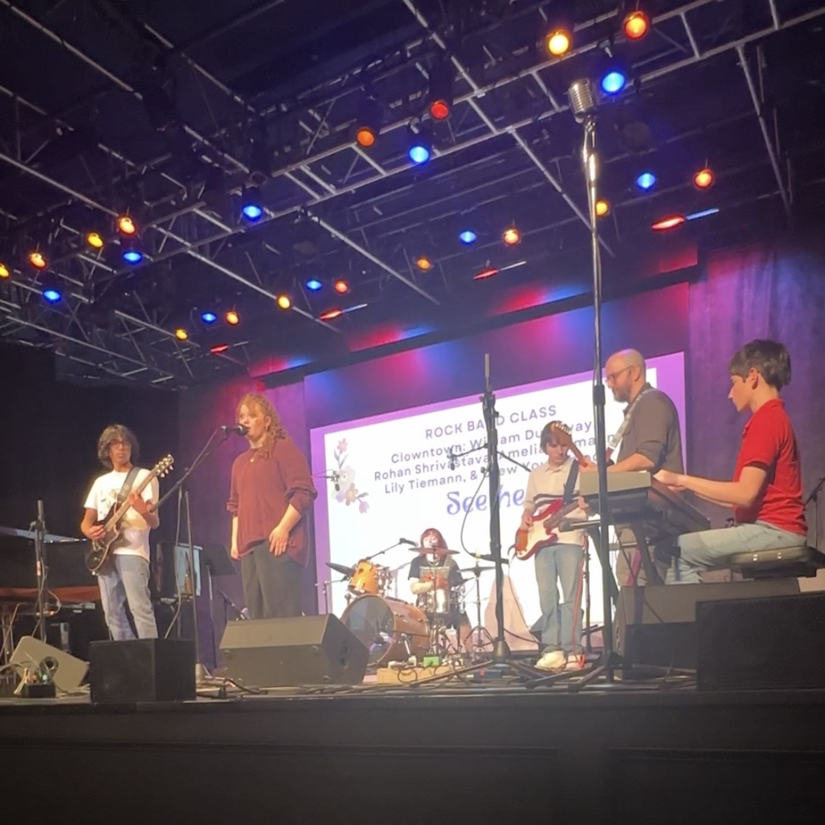 The Rock Band Class performs on stage at the Spring Showcase