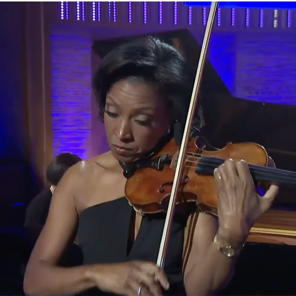 Kelly plays the violin